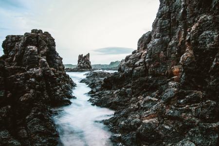 Massive Rock Formation In The Middle Of Ocean