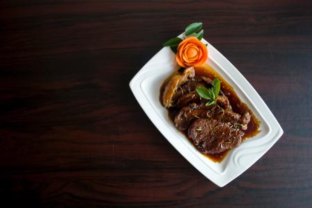 Meat With Sauce Dish on White Ceramic Plate