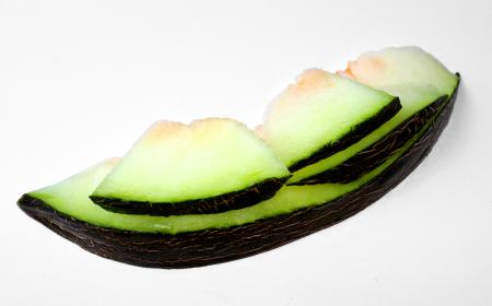 Melon slices on white