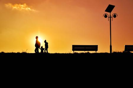 Men Riding Silhouette People on Street Against Sky during Sunset