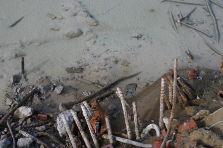 Metal bars in water