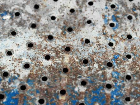 Metal Holes Rusted Background