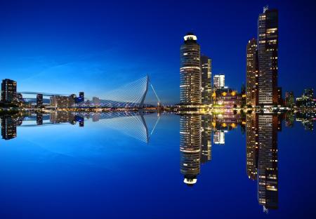 Mirrored Image of High Rise Buildings and Bridge