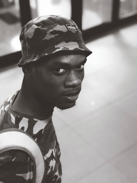 Monochrome Photo of a Man Wearing Camouflage Shirt