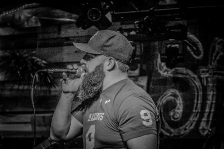 Monochrome Photography of a Man Singin