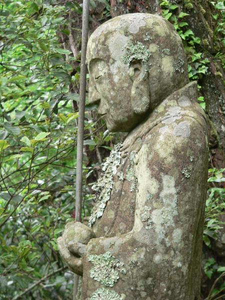 Moss covered Japanese Jizo Bodhisattva statue