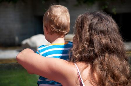 Mother and her son looking out