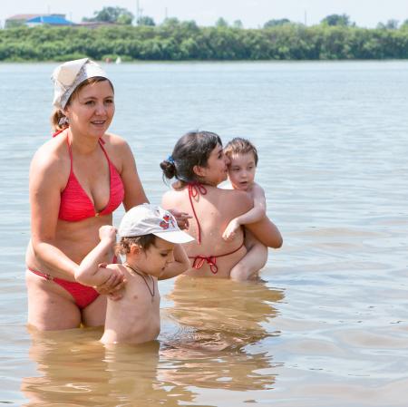 Mothers and children bathing