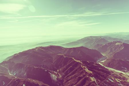 Mountains during Daytime and White Cloudy Sky