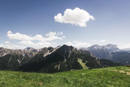 Mountains Under Cloudy Sky during Daytime