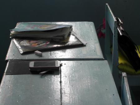 Notebook and Phone on a School Desk
