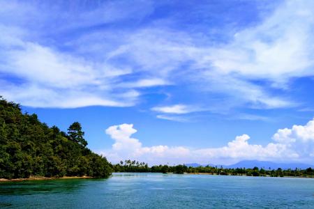 Ocean Under Blue Sky and White Clouds