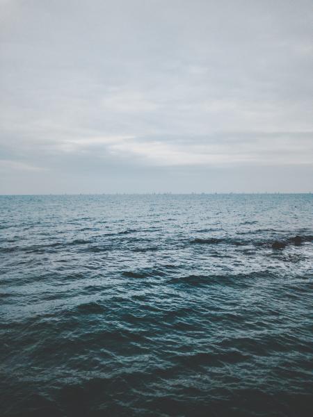 Ocean Under Cloudy Sky