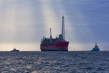 Oil and gas FPSO at sunset