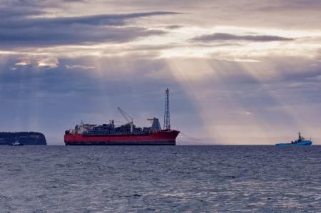 Oil and gas FPSO at sunset