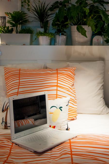 open laptop on a bed