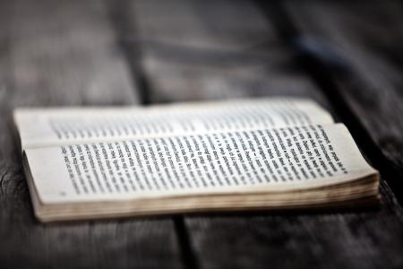 Opened Book on Wooden Board