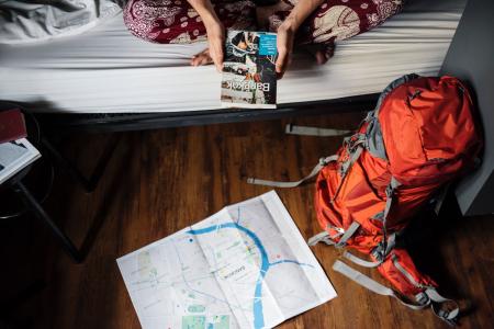 Orange and Gray Hiking Backpack on the Floor