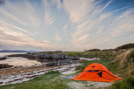 Orange Camping Tent Near Body of Water during Daytime