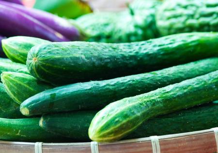 Organic Cucumbers Being Sold In A Market