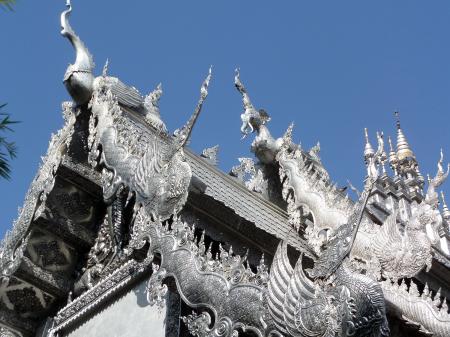 Ornate silvered Buddhist temple roof