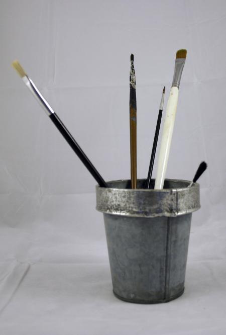 Paint brushes in tin can