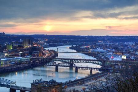 Panorama View of Suspension Bridge Connecting Urban City during Golden Hour