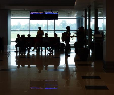 Passenger Silhouettes at Airport