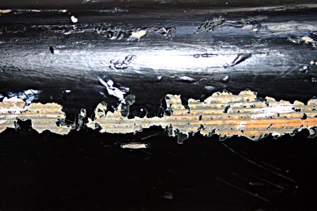 Peeled black paint on wood