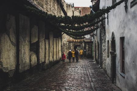 People on the Street Between Houses