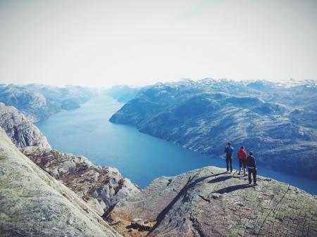 People on Top of Mountain Range