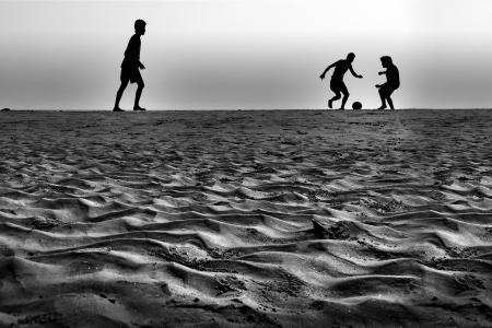 People Playing Ball in Grey Sound