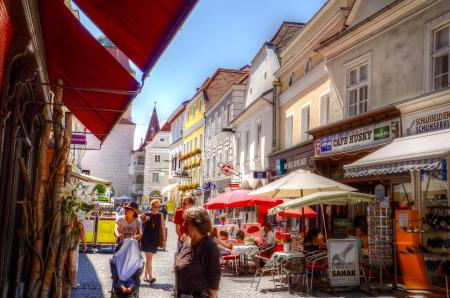 People Standing Between Concrete Buildings