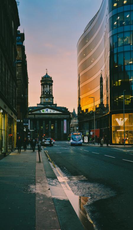 People Walking at Sidewalk during Sunset