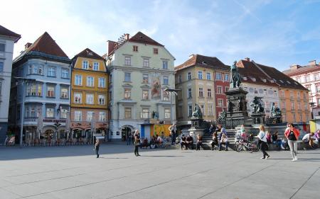 People Walking in Front of Buildings