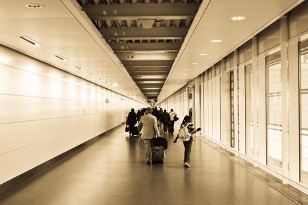 People Walking in the Hallway Inside the Building