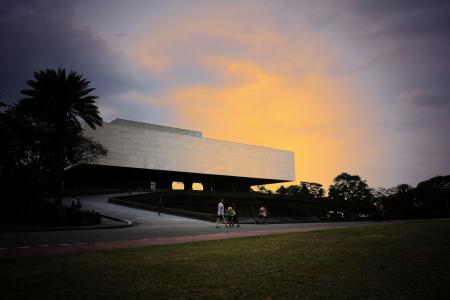 People Walking Near White Concrete Structure