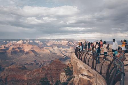 People Watching View from Top of Mountain