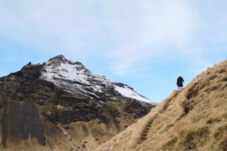 Person Climb on Mountain