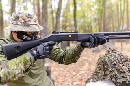 Person Holding Black Pump Shotgun