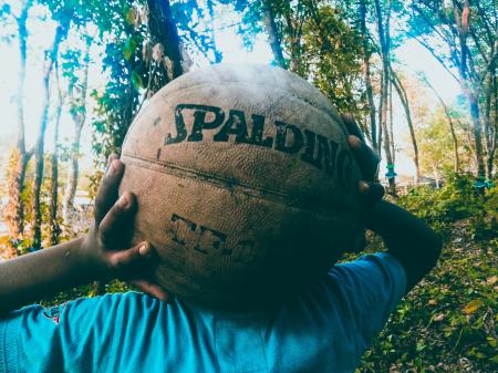 Person Holding Brown Spalding Basketball