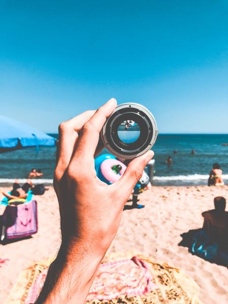 Person Holding Camera Lens