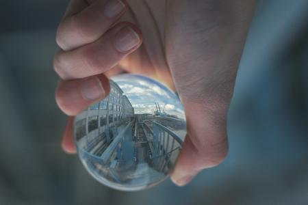 Person Holding Clear Glass Decor