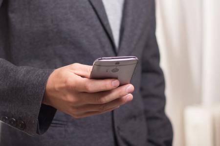 Person Holding Grey Smartphone