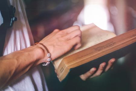 Person Holding Hardbound Book