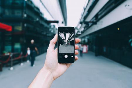 Person Holding Space Gray Iphone 5s