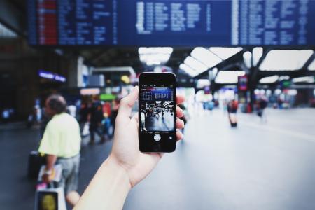 Person Holding Space Gray Iphone 5s on Camera Application