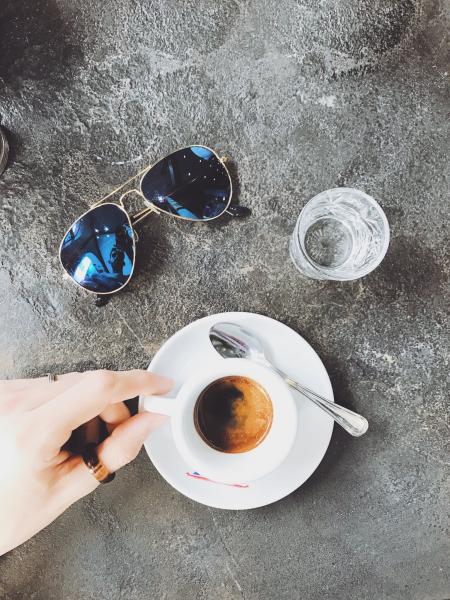 Person Holding White Ceramic Cup Filled With Coffee