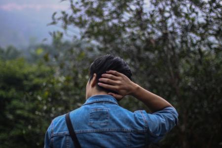 Person in Blue Denim Jacket