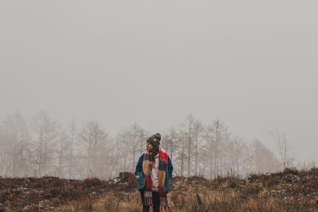 Person in Brown and Red Scarf